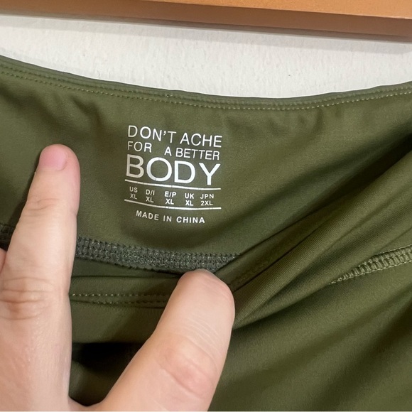 Green Athletic Shorts with Adjustable Side Ties and Curved Hem - Picture 3 of 6